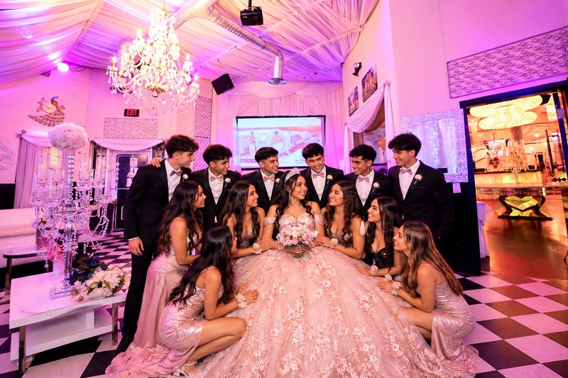 Quinceañera with her court in the VIP room